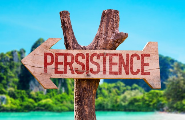 Persistence arrow with beach background